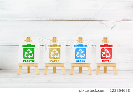 Eco-Friendly Recycling Bins for Plastic, Paper, Glass, and Metal on Wooden Easels Eco-Friendly Recycling Bins for Plastic, Paper, Glass, and Metal on Wooden Easels 122864658