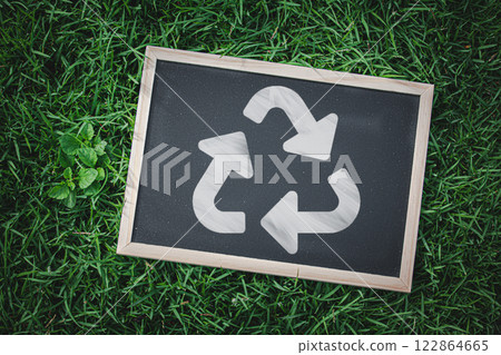 Green Initiatives: Blackboard with Recycle Symbol in Outdoor Environment 122864665