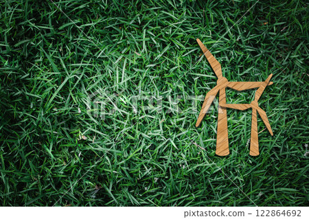 Wind Energy Icon: Wooden Wind Turbine on Grass Background Representing Eco-Friendly Power Generation Wind Energy Icon: Wooden Wind Turbine on Grass Background Representing Eco-Friendly Power Generation 122864692