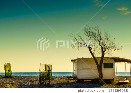 Caravan trailer on sunny beach 122864988
