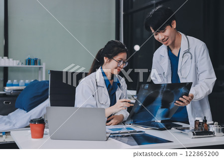 Implement those changes and we can see. Shot of a group of nurses and doctors having a meeting together. 122865200