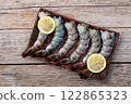 Raw big tiger ( king ) shrimps Cleaned, Peeled & Deveined photography . Top view 122865323