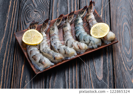 Raw big tiger ( king ) shrimps Cleaned, Peeled & Deveined photography . Top view 122865324