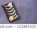 Raw big tiger ( king ) shrimps Cleaned, Peeled & Deveined photography . Top view 122865325