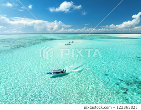 Aerial view of colorful boats in clear azure water in summer 122865823