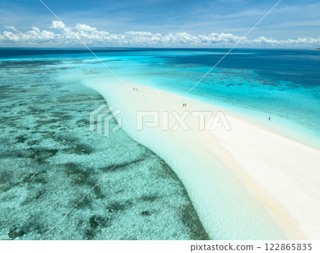 Aerial view of island, sandbank with white sandy beach, blue sea Aerial view of island, sandbank with white sandy beach, blue sea 122865835