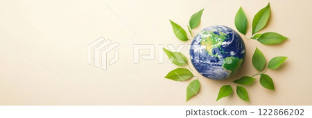 Earth icon with green leaves on a pastel background promoting environmental conservation, Earth Day concept 122866202