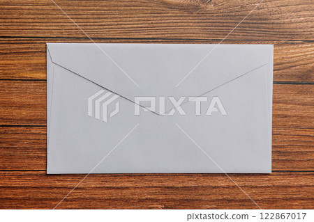 An envelope on the desk 122867017