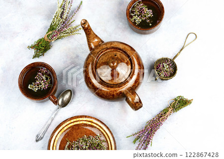 Cup of tea and branch of heather. Cup of tea and branch of heather. 122867428