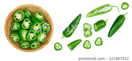 sliced jalapeno pepper in wooden bowl isolated on white background. Green chili pepper . Top view. Flat lay 122867832