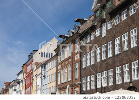 Old Nyhaven port, famous place in Copenhagen, Denmark. 122868352