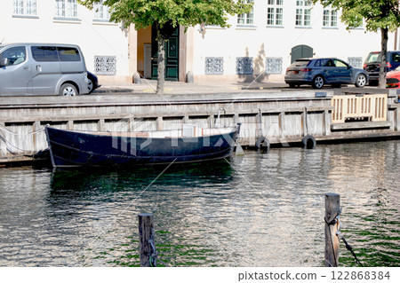 Boat on the Christianshavn canal in Copenhagen. Summer in Denmark. 122868384