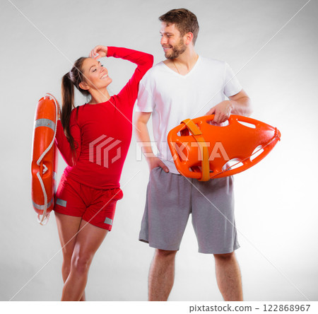 lifeguard couple with rescue equipment lifeguard couple with rescue equipment 122868967