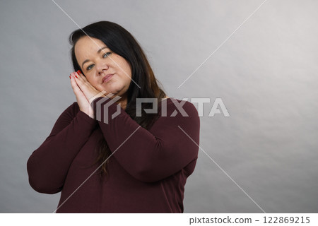 Woman being sleepy gesturing Woman being sleepy gesturing 122869215