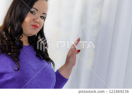 Plus size adult woman portrait 122869236