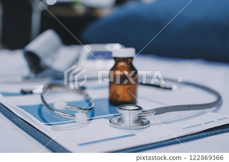 stethoscope on a report stethoscope on a clipboard stethoscope on a book 122869366