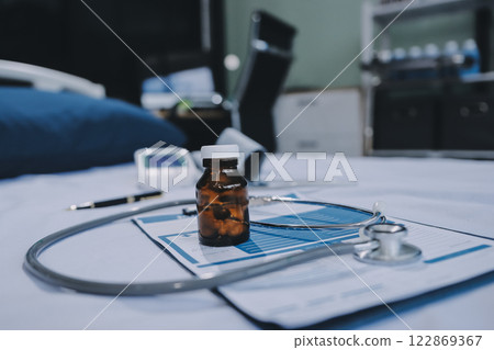 stethoscope on a report stethoscope on a clipboard stethoscope on a book 122869367