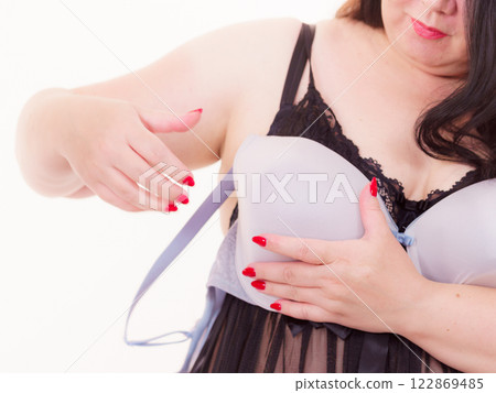 Woman plus size holding bra Woman plus size holding bra 122869485
