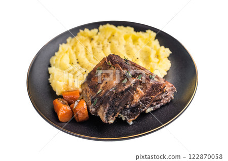 Braised beef short ribs resting on a bed of creamy mashed potatoes, creating an inviting culinary scene isolated on white background. top view 122870058