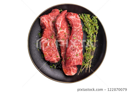 Tri tip steaks, Raw marbled beef meat on plate with herbs isolated on white background 122870079