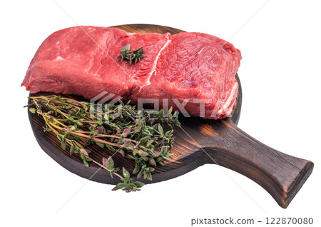 Fresh raw bison meat displayed on a wooden board, showcasing its rich red color and tenderness, ideal for gourmet cooking adventures. isolated on white background. top view Fresh raw bison meat displayed on a wooden board, showcasing its rich red color and tenderness, ideal for gourmet cooking adventures. isolated on white background. top view 122870080