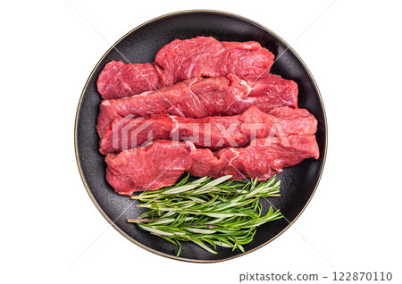 Raw bison meat presented with fresh herbs and spices, inspiring bold flavors and unique recipes for adventurous food lovers. isolated on white background. top view Raw bison meat presented with fresh herbs and spices, inspiring bold flavors and unique recipes for adventurous food lovers. isolated on white background. top view 122870110
