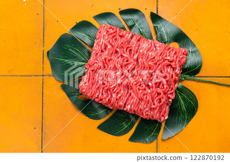 Freah Raw beef and veal ground meat, forcemeat, on kitchen background. 122870192