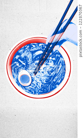 Hand with chopsticks and ramen noodles with boiled egg, in detailed blue bowl against white textured background. Hand with chopsticks and ramen noodles with boiled egg, in detailed blue bowl against white textured background. 122870367