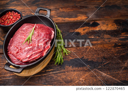 Ready for cooking beef cheeks, raw meat in skillet. wooden background. top view Ready for cooking beef cheeks, raw meat in skillet. wooden background. top view 122870465