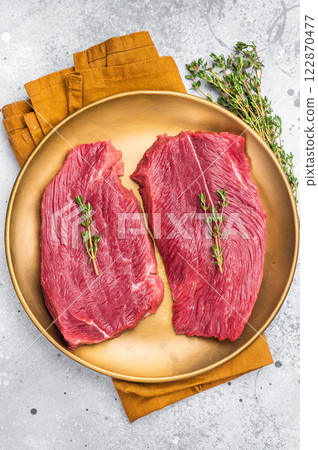 Raw Venison steak, fresh Wild Roe Deer Game Meat. grey background. top view 122870477