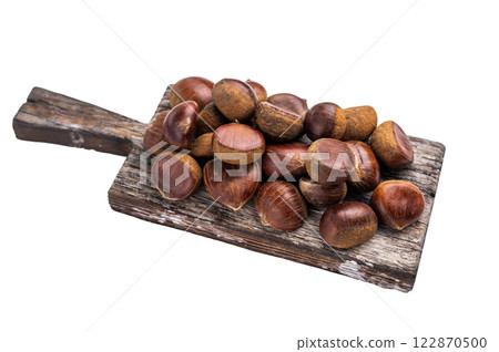 Fresh raw chestnuts on rustic wooden board isolated on white background 122870500