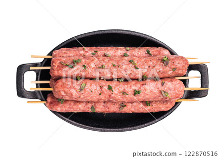Raw shish kebab, arabic kofta kofte kebab from mince lamb and beef meat on Skewer isolated on white background. top view 122870516