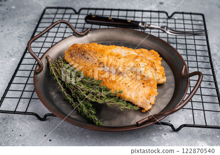 Fried pollock white fish fillet. grey background. top view 122870540