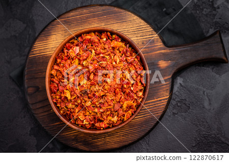 Dried and chopped Tomato for cooking. black background. top view 122870617