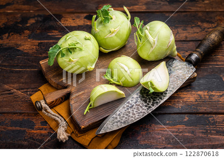 Cabbage kohlrabi on wooden board, raw Organic Vegetable. wooden backround. top view Cabbage kohlrabi on wooden board, raw Organic Vegetable. wooden backround. top view 122870618