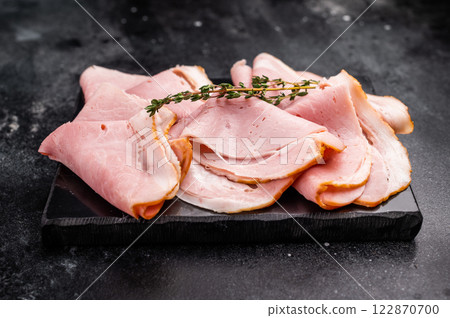 Thinly Sliced Pork Ham Prosciutto Cotto. black background. top view 122870700
