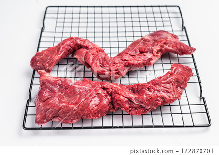 Raw Beef Skirt Steak, Machete steak, uncooked meat isolated on white background 122870701