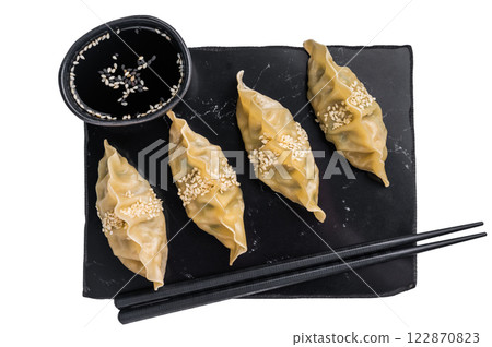 Steamed Japanese Gyoza Dumplings with meat and vegetables isolated on white background. top view Steamed Japanese Gyoza Dumplings with meat and vegetables isolated on white background. top view 122870823