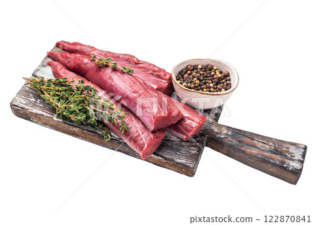 Raw lamb tenderloin fillet pieces, fresh mutton meat on wooden board isolated on white background. top view 122870841