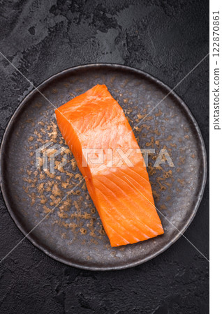 Perfect Salmon fillet steak, raw fish on a plate. black background. top view 122870861