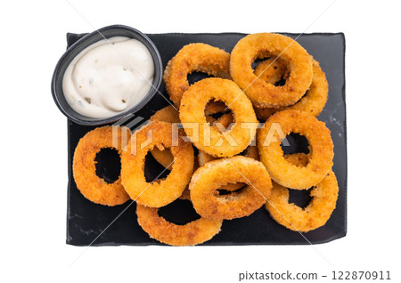 Deep fried squid rings with breading, calamari fastfood snack isolated on white background. top view 122870911