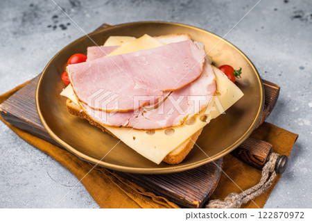 Ham and cheese sandwich, toast with sliced Prosciutto Cotto. grey background. top view 122870972