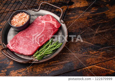 Ready for cooking Raw Rump beef steak with herbs. wooden background. top view 122870999