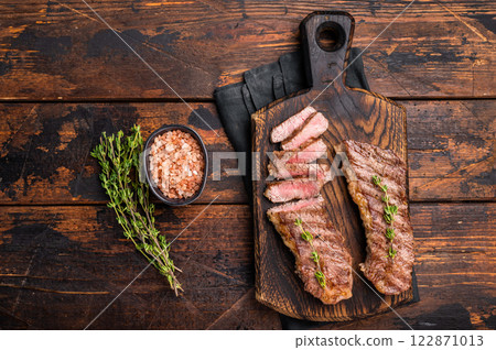 Grilled Tri Tip Steak from Black Angus beef meat. wooden background. top view 122871013
