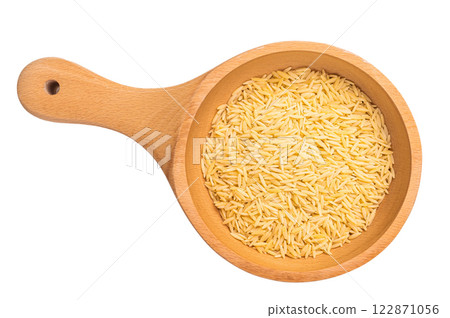 Raw Orzo pasta, uncooked dry Italian risoni in a bowl isolated on white background. top view Raw Orzo pasta, uncooked dry Italian risoni in a bowl isolated on white background. top view 122871056