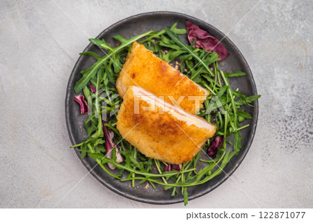 Fried Cordon bleu escalopes with salad on plate. white background. top view Fried Cordon bleu escalopes with salad on plate. white background. top view 122871077