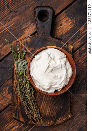 Dip sauce with Fresh Sour cream in a bowl. wooden background. top view 122871119