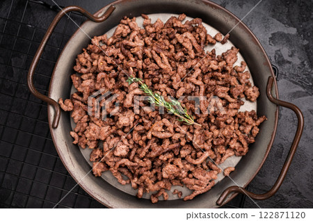 Fried mince beef and pork meat, fresh cooked mincemeat. black background. top view 122871120