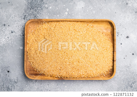 Homemade organic bread crumbs in a wooden tray. gray background. top view Homemade organic bread crumbs in a wooden tray. gray background. top view 122871132