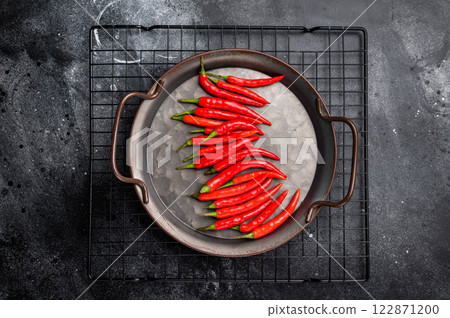 Hot Red chili peppers in a steel tray isolated on white background. top view 122871200